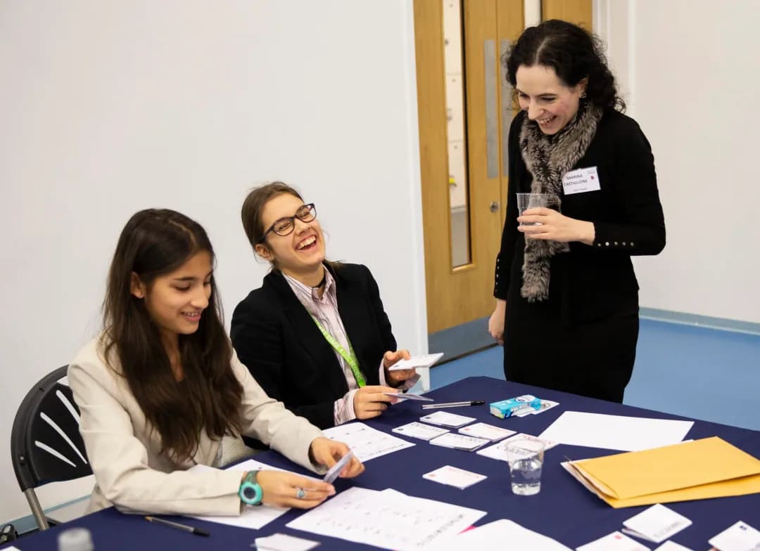 Students laughing with a STEM role model at a WISE session at Reading UTC