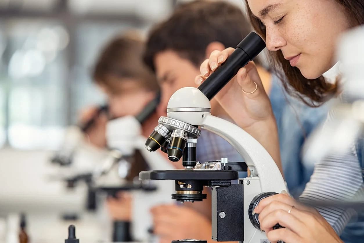 Student using a microscope in a science lesson