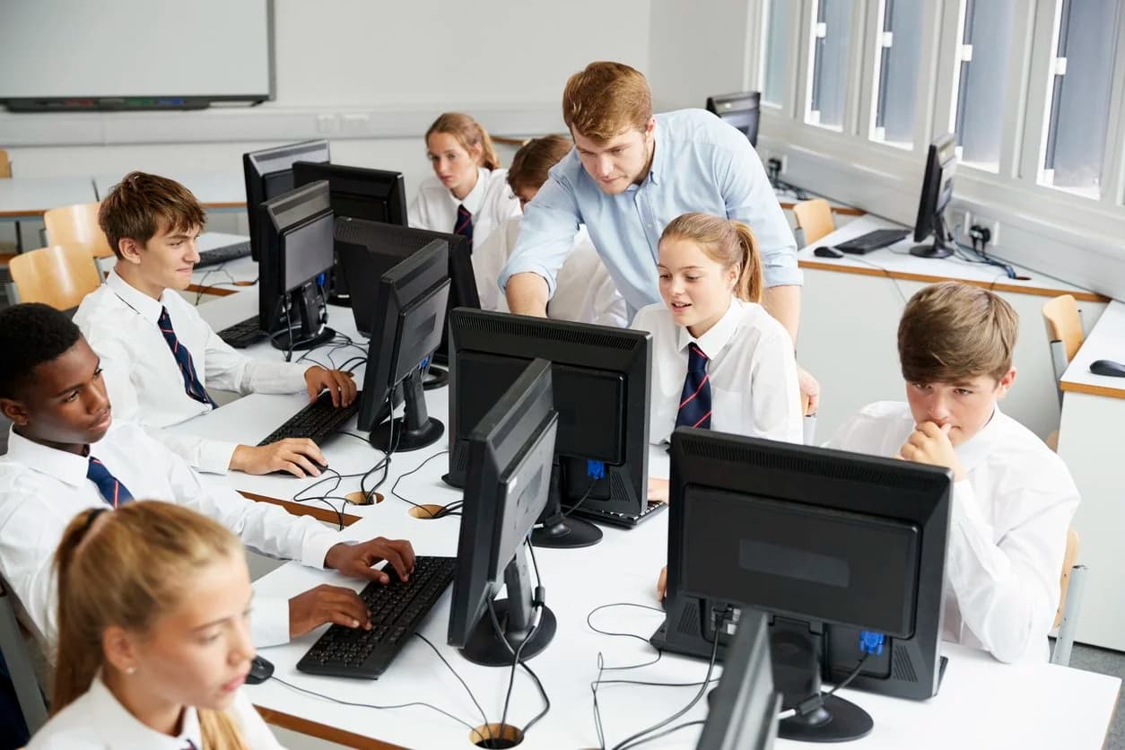 Students working at computers in a classroom