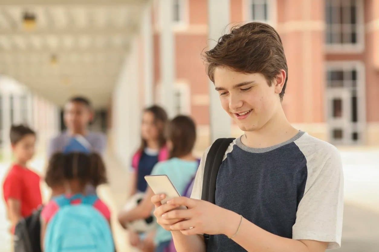 Boy using the Tassomai app on his phone