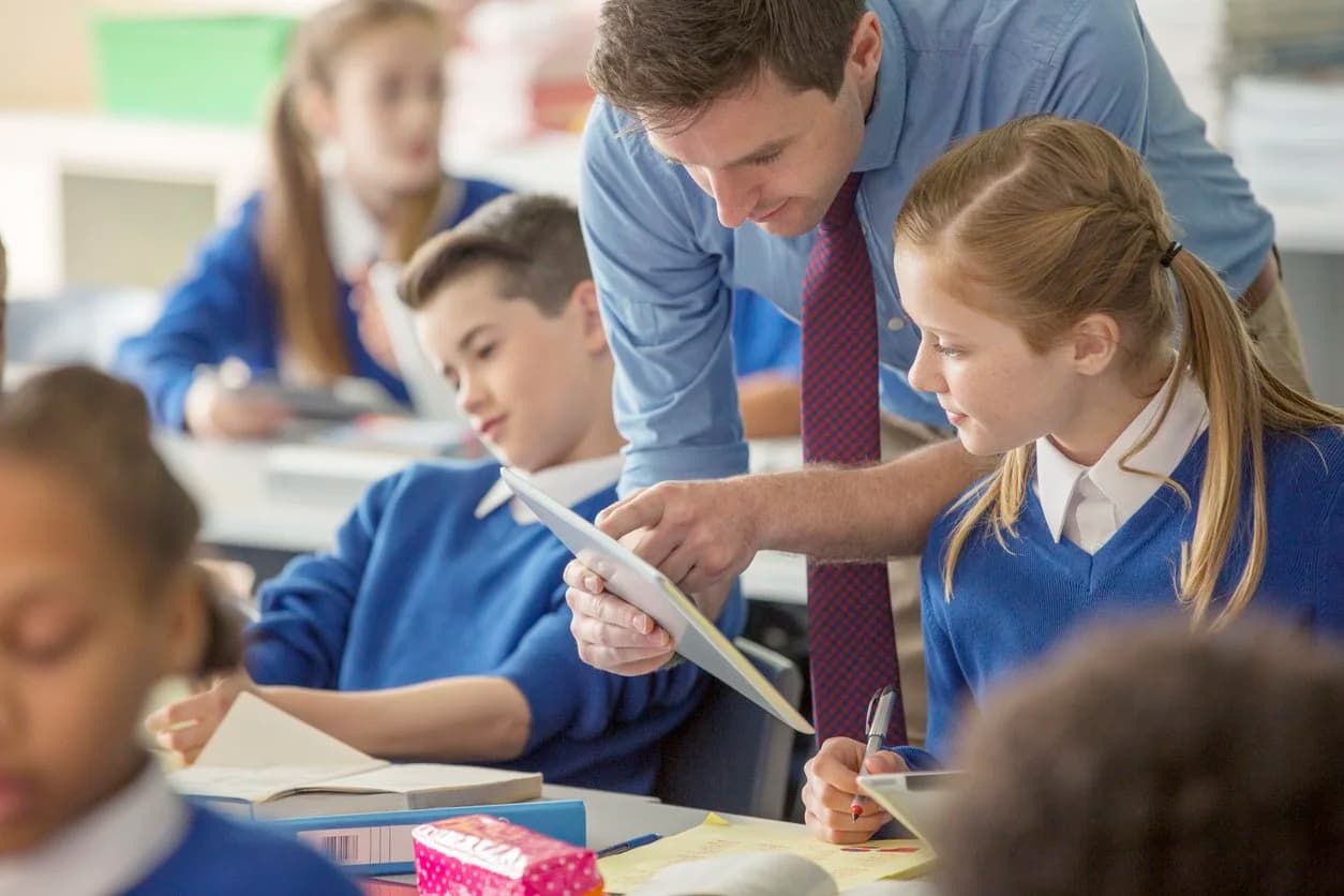 Teacher working with pupils in a classroom